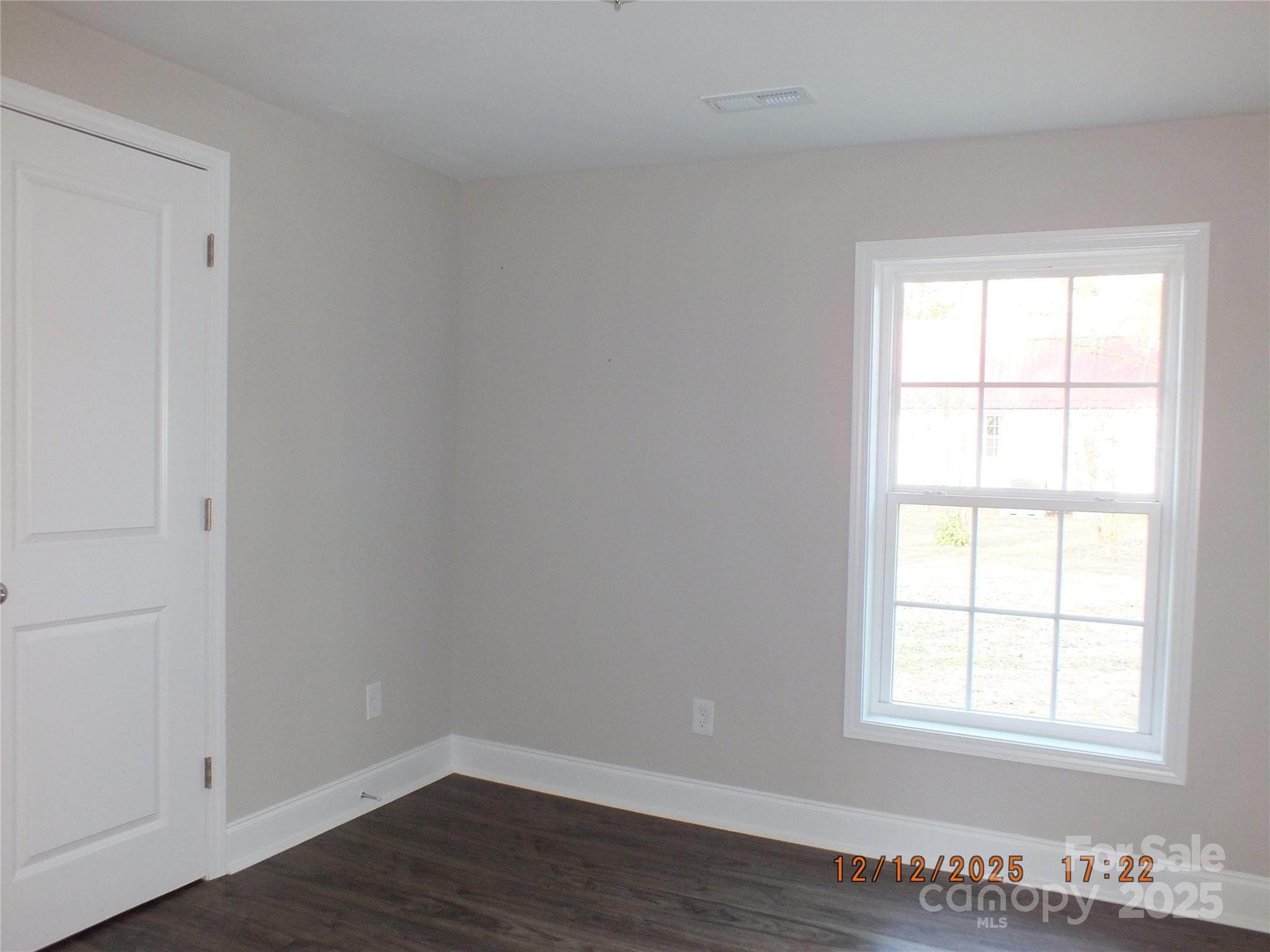 1740 Rocky River Road Lancaster, SC 29720 - Photo 22 of 31 an empty room with wooden floor