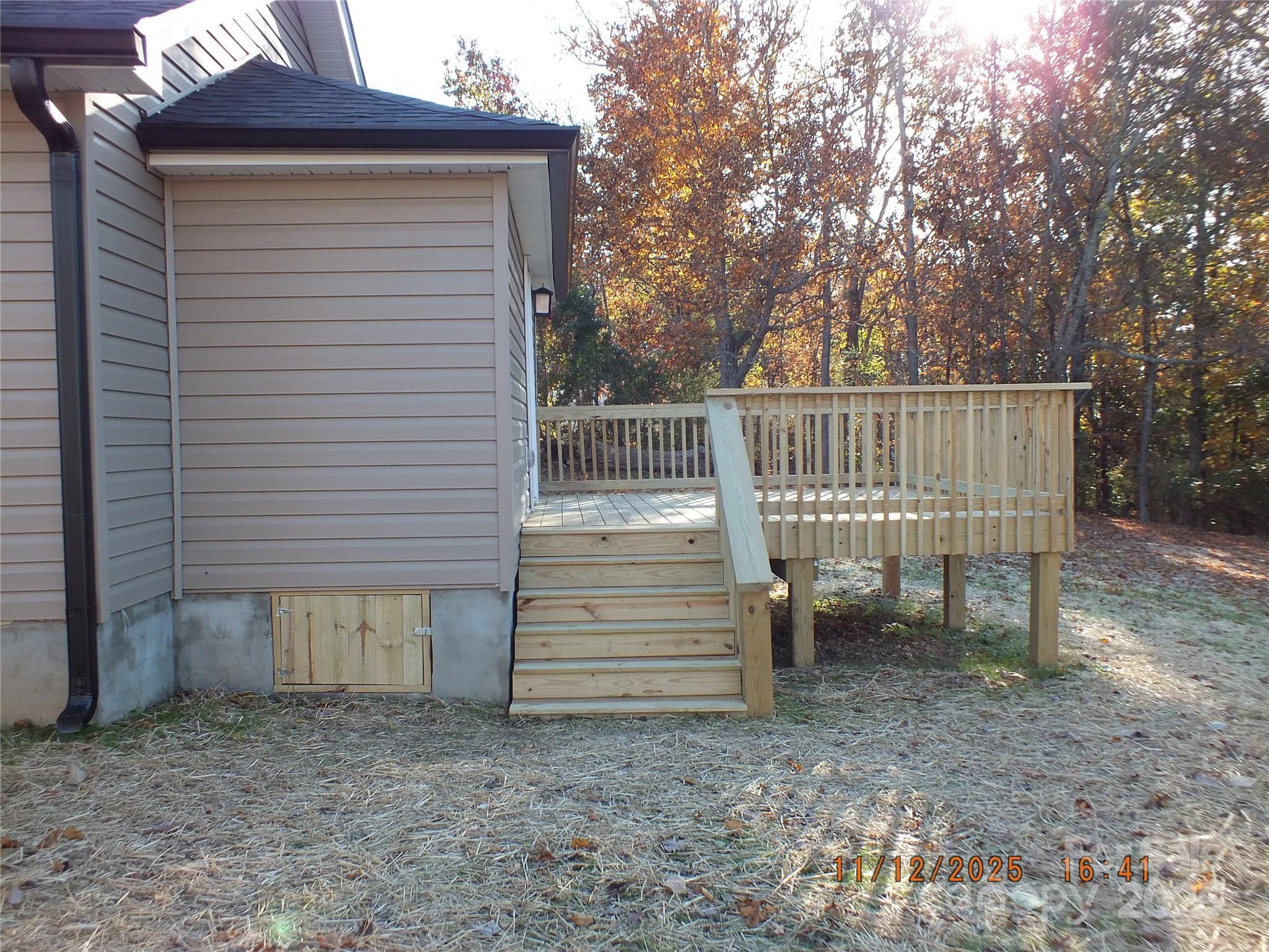 1740 Rocky River Road Lancaster, SC 29720 - Photo 29 of 31 a view of a small house with wooden fence and large trees