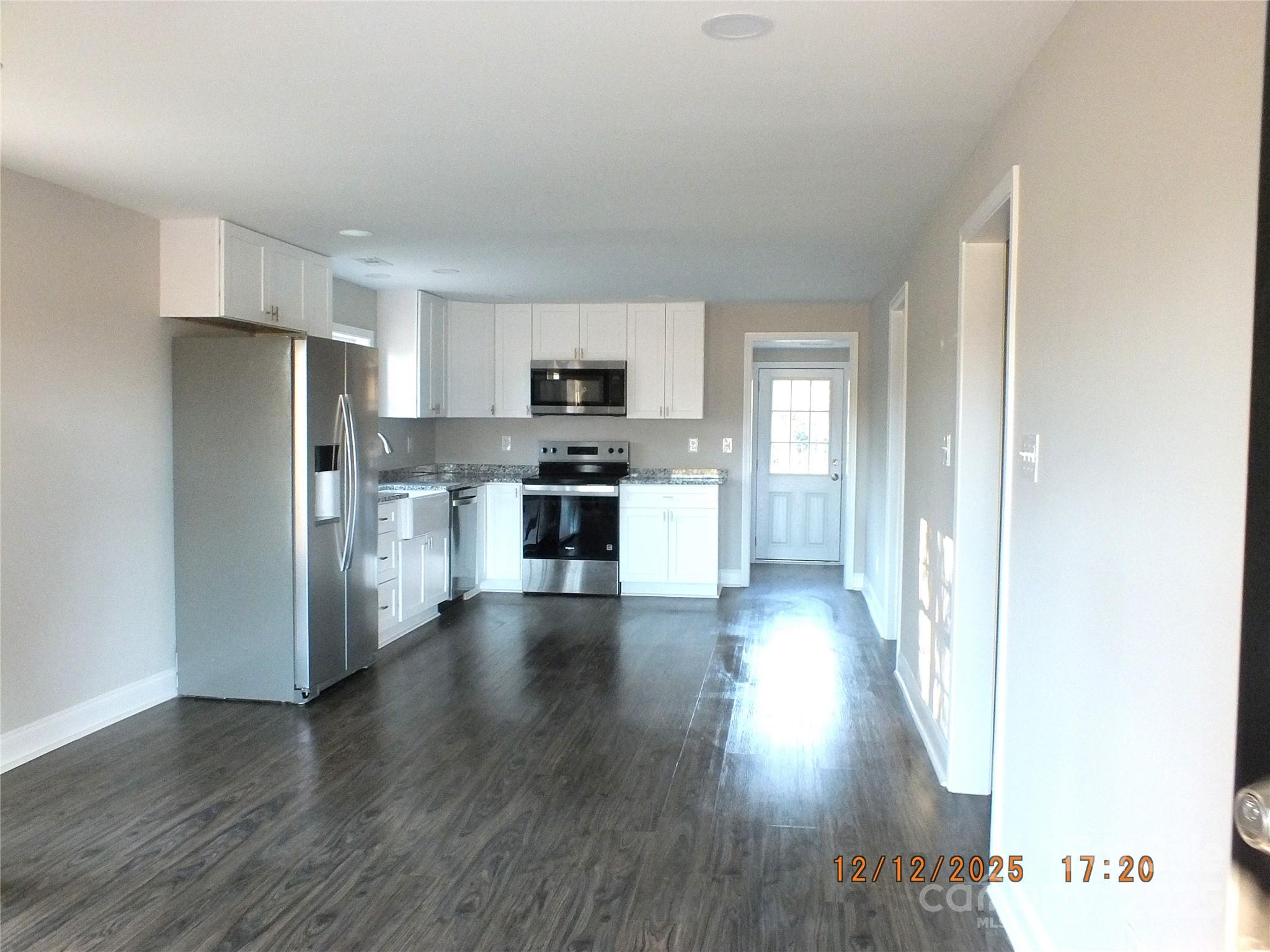 1740 Rocky River Road Lancaster, SC 29720 - Photo 4 of 31 a kitchen with stainless steel appliances a refrigerator and a stove top oven