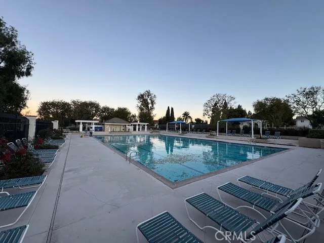 a view of swimming pool from a balcony