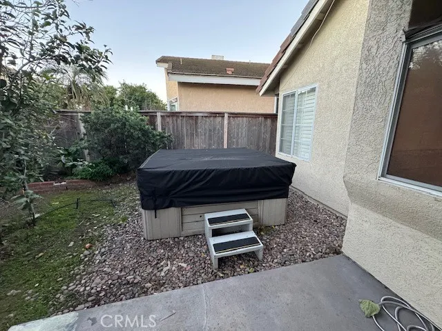 a view of backyard with barbeque grill and outdoor seating