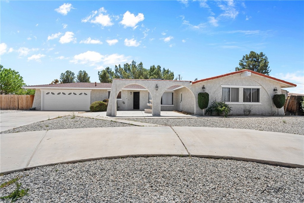 19165 Chole Road Apple Valley, CA 92307 - Photo 1 of 1 a front view of a house with a yard