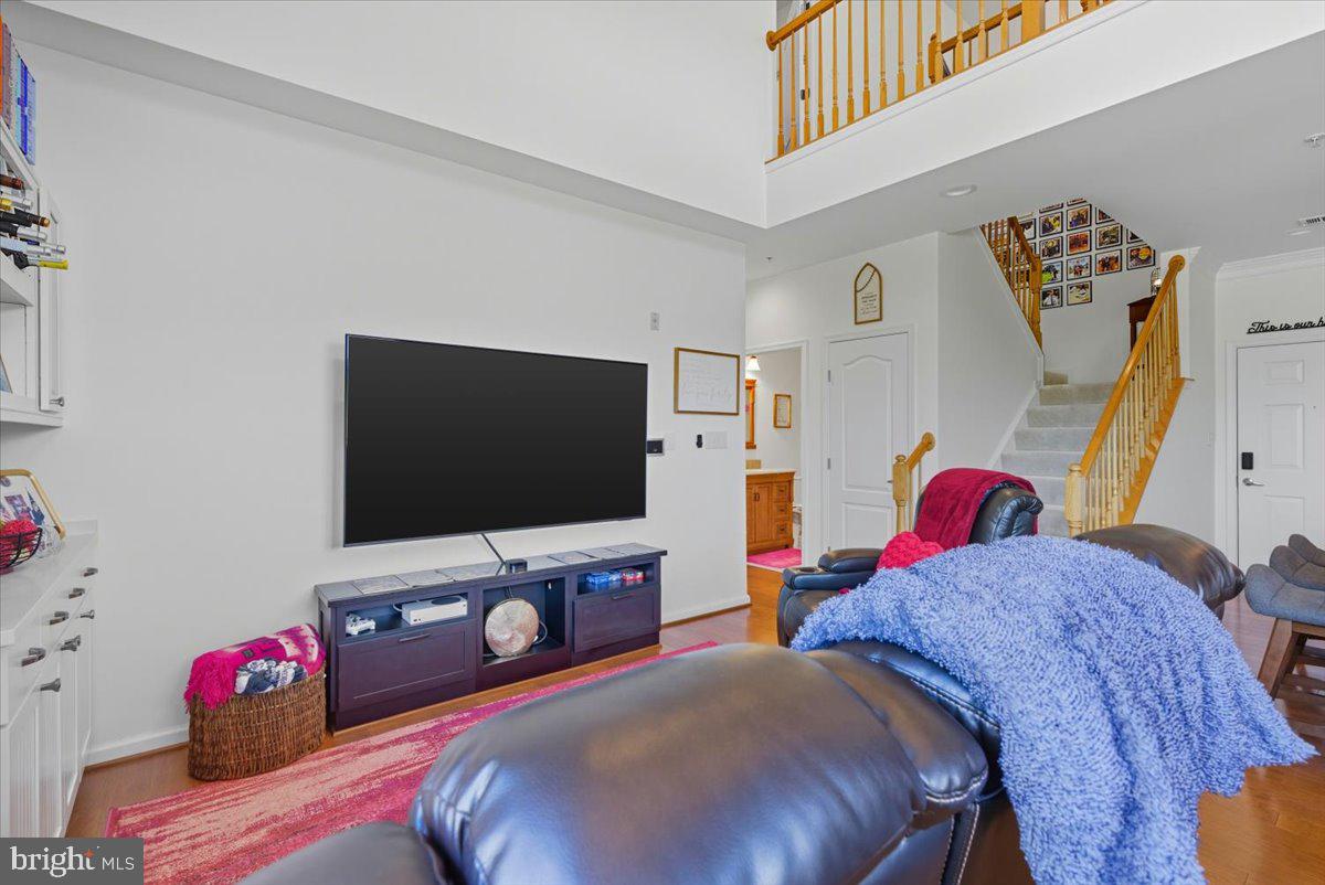 9000 Lorton Station Boulevard, Unit 2115 Lorton, VA 22079 - Photo 11 of 35 a living room with furniture and a flat screen tv