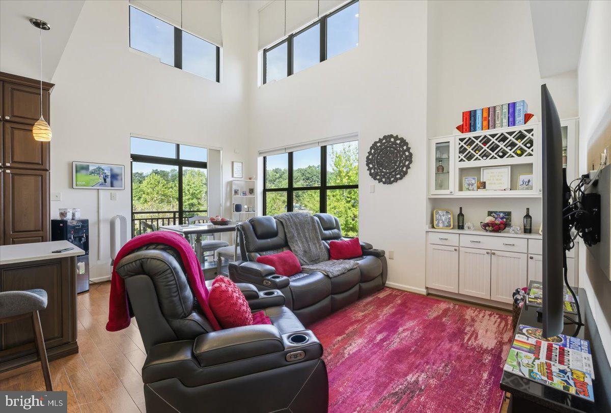 9000 Lorton Station Boulevard, Unit 2115 Lorton, VA 22079 - Photo 13 of 35 a living room with furniture and a rug