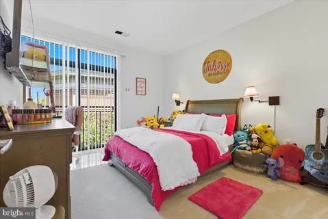 a bedroom with bed and a window