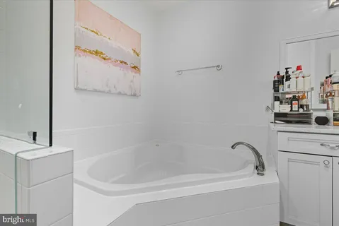 a bathroom with a bathtub and sink