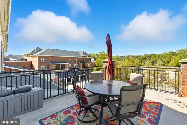 a view of a balcony with furniture and a table