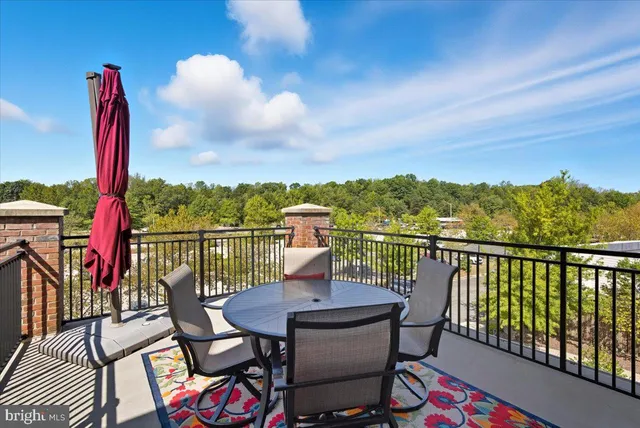 a view of a balcony with furniture
