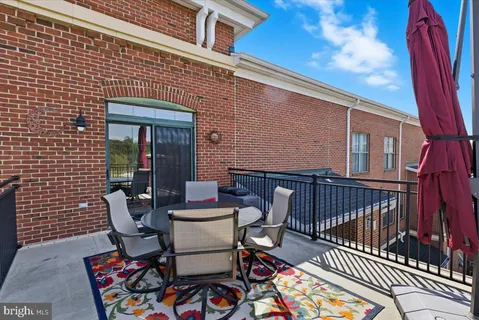 a couple of chairs sitting in front of a house