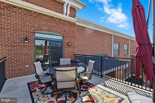 a couple of chairs sitting in front of a house