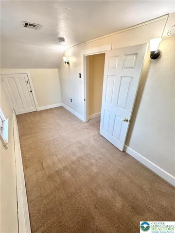 a view of a backyard with table and chairs