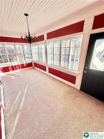 a view of empty room with windows