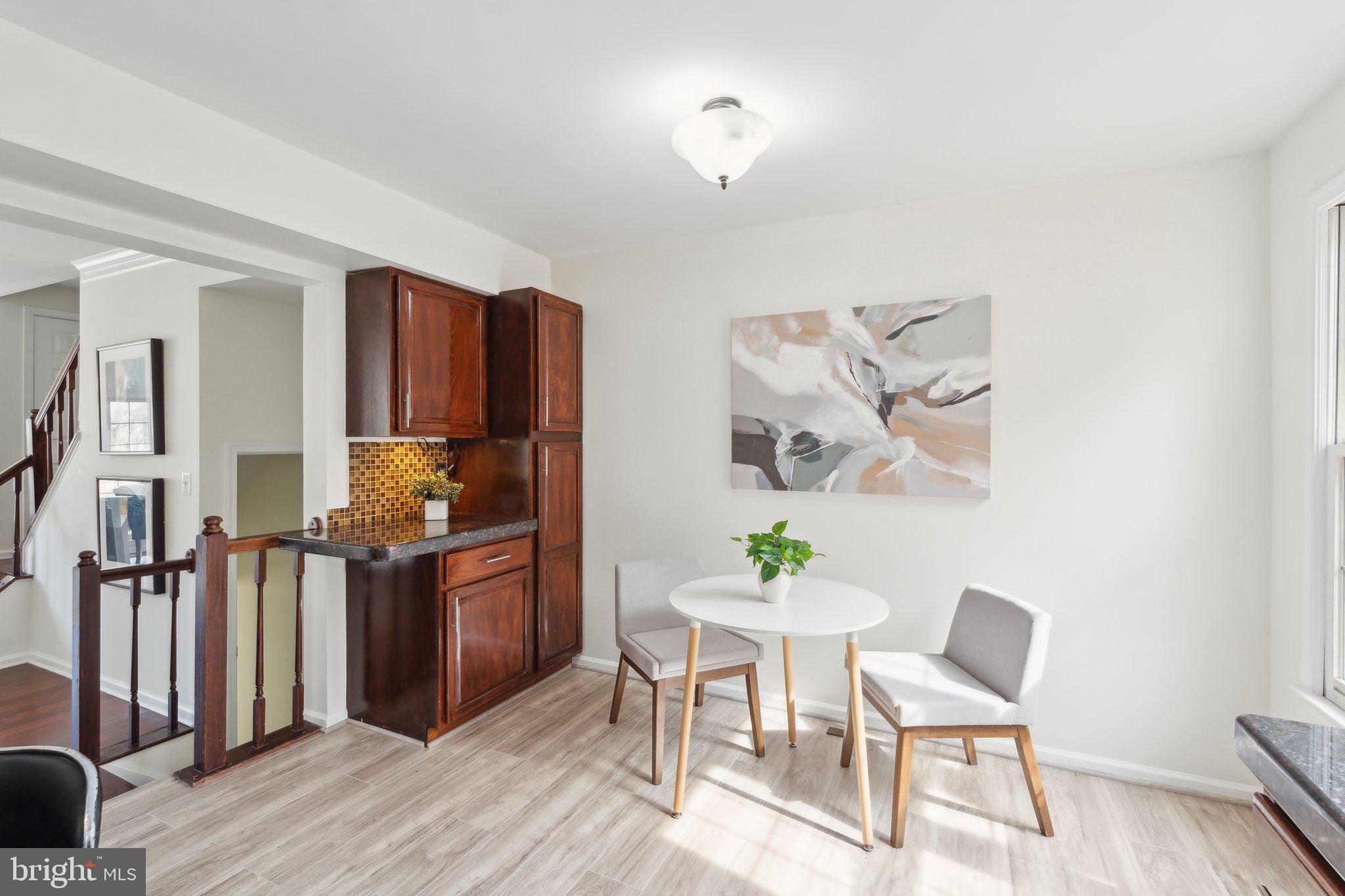46924 Rabbitrun Terrace Sterling, VA 20164 - Photo 13 of 38 a view of a dining room with furniture and wooden floor