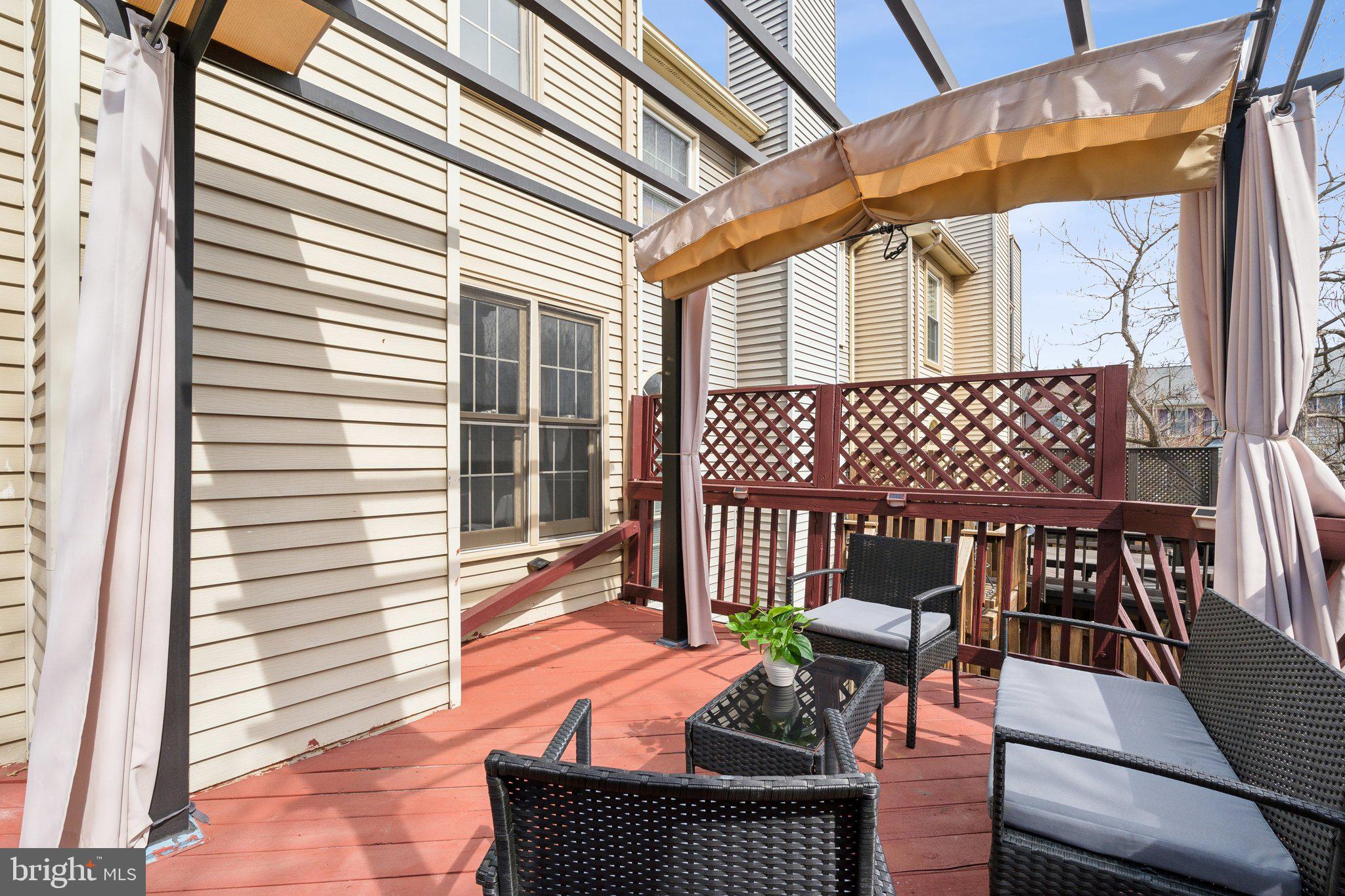 46924 Rabbitrun Terrace Sterling, VA 20164 - Photo 18 of 38 a view of a patio with a table and chairs