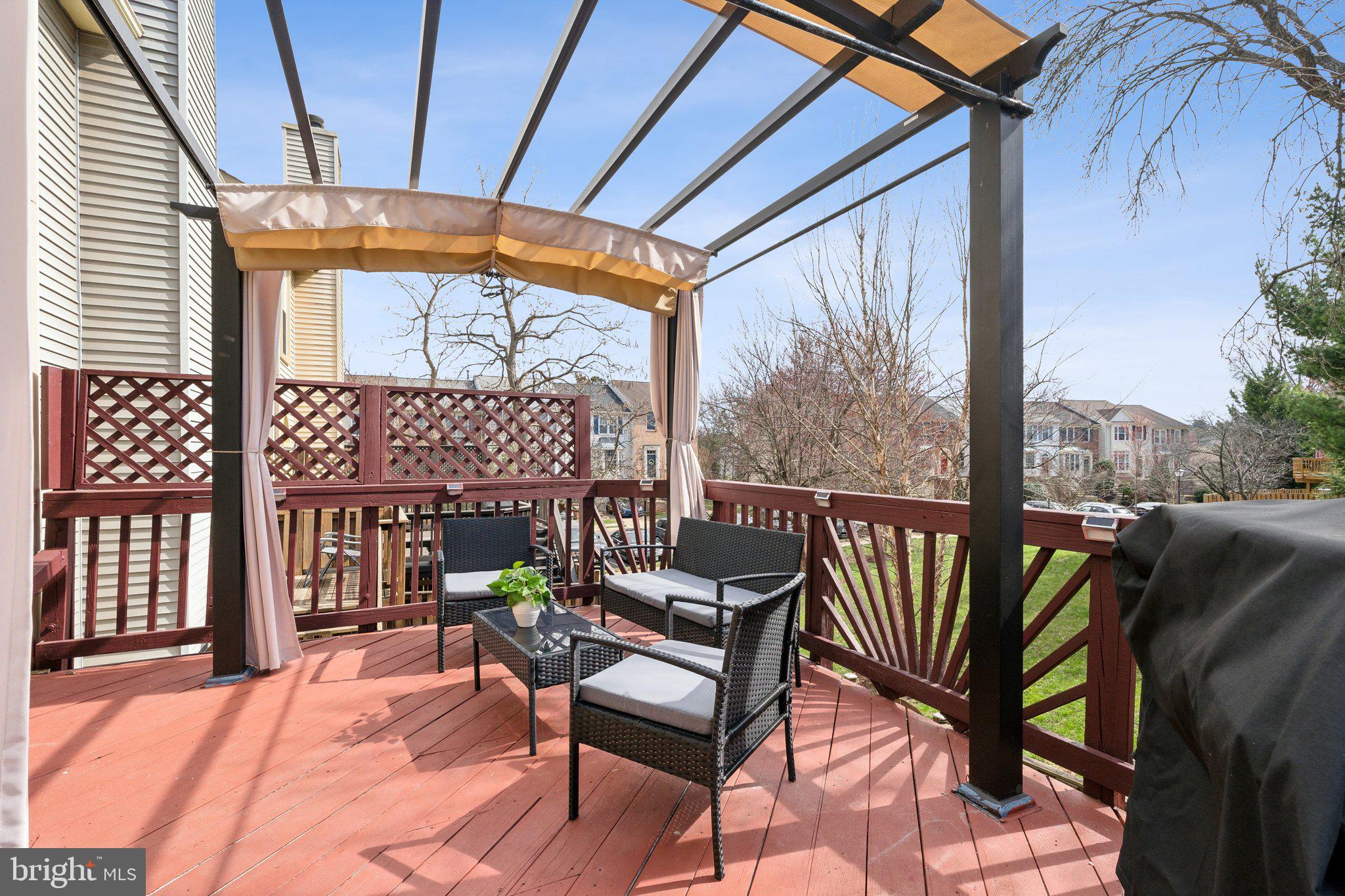 46924 Rabbitrun Terrace Sterling, VA 20164 - Photo 20 of 38 a view of a chairs and table in the patio