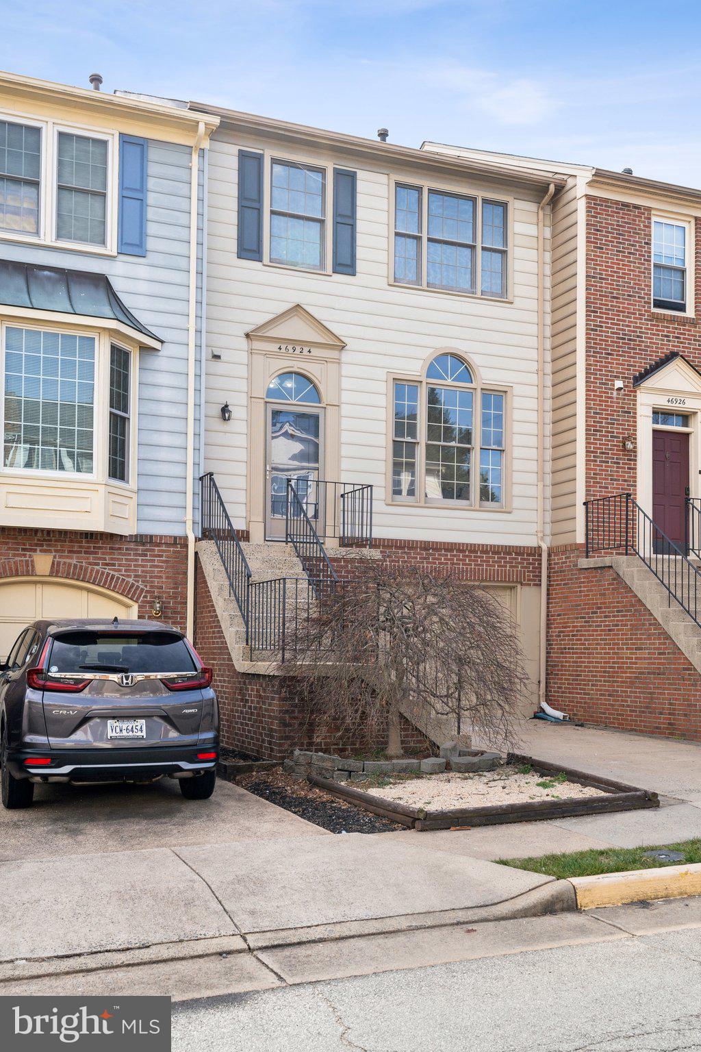 46924 Rabbitrun Terrace Sterling, VA 20164 - Photo 2 of 38 a car parked in front of a house