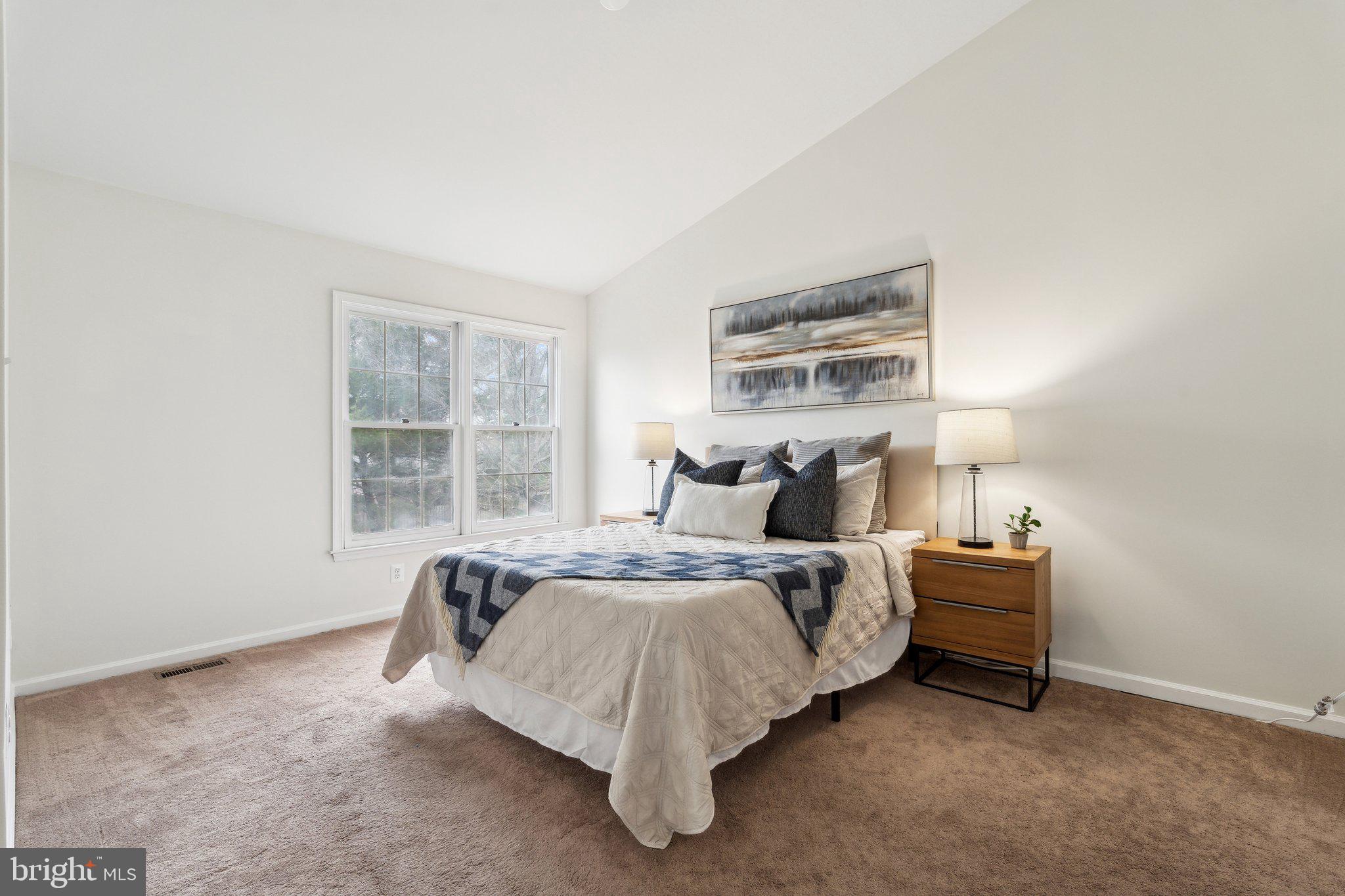 46924 Rabbitrun Terrace Sterling, VA 20164 - Photo 21 of 38 a bed sitting in a bedroom next to a window