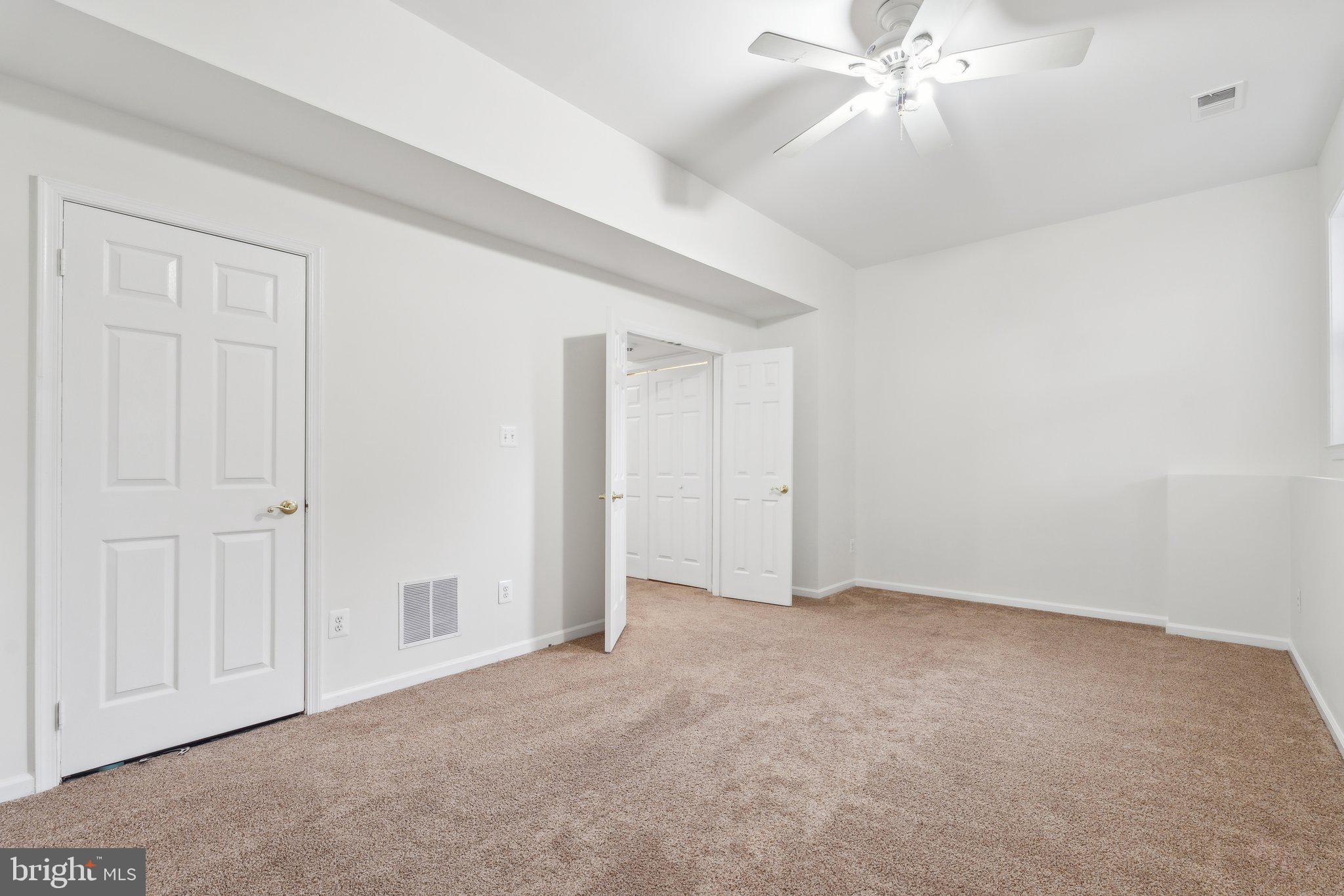 46924 Rabbitrun Terrace Sterling, VA 20164 - Photo 31 of 38 an empty room with a chandelier fan