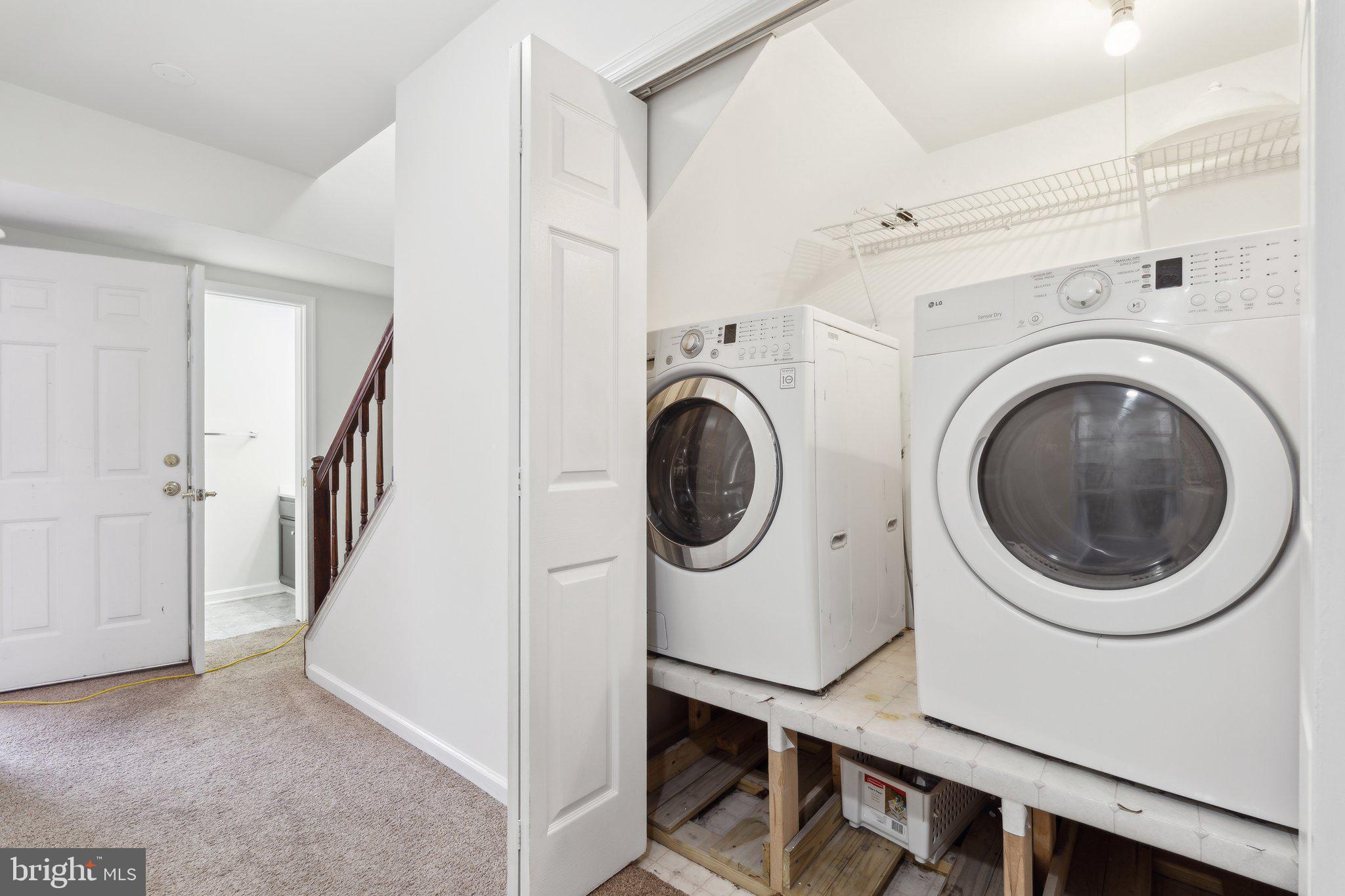 46924 Rabbitrun Terrace Sterling, VA 20164 - Photo 34 of 38 a view of a hallway with washer and dryer