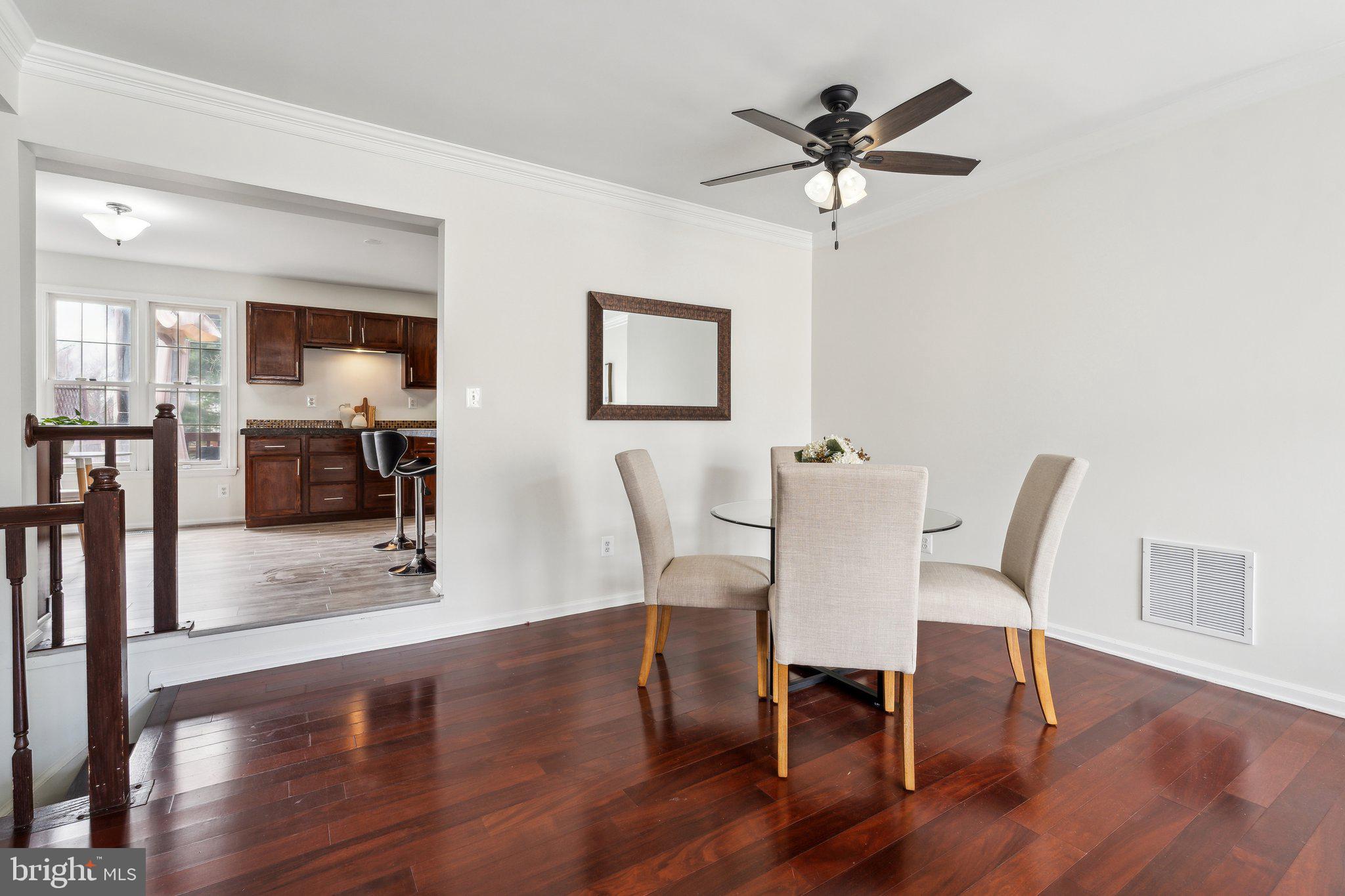 46924 Rabbitrun Terrace Sterling, VA 20164 - Photo 9 of 38 a view of a dining room with furniture and wooden floor