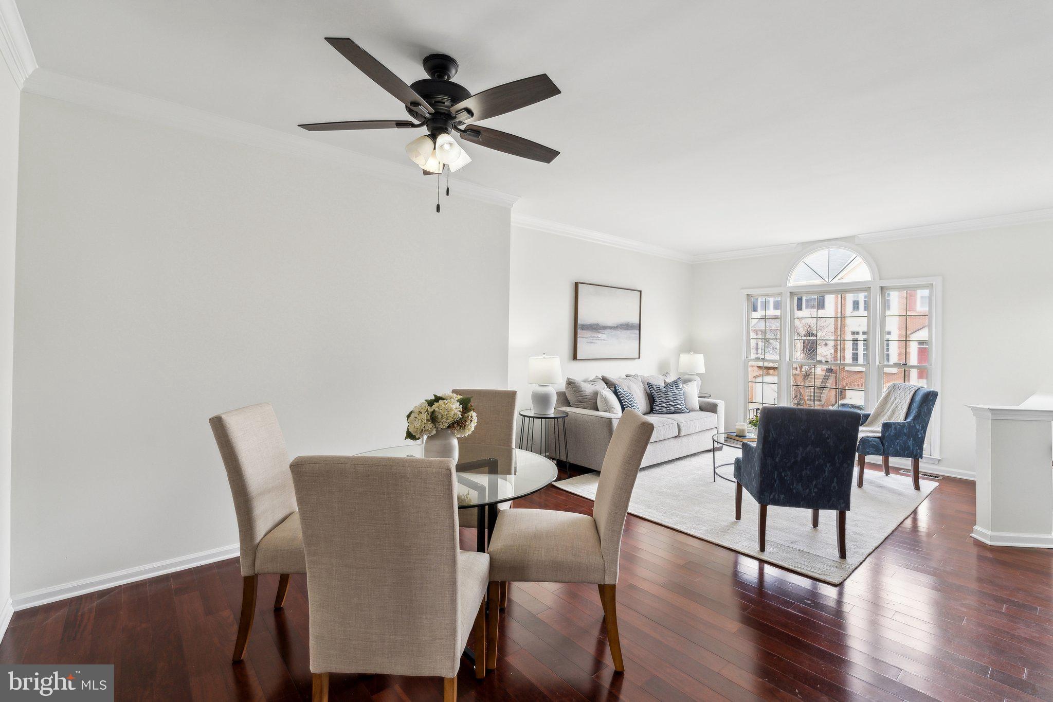 46924 Rabbitrun Terrace Sterling, VA 20164 - Photo 10 of 38 a view of a dining room with furniture window and wooden floor