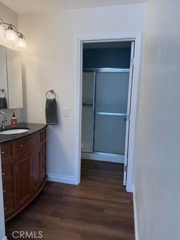 a view of an entryway with wooden floor