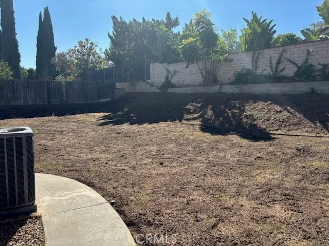a view of a backyard of the house