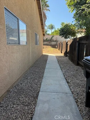 a view of a pathway with a patio