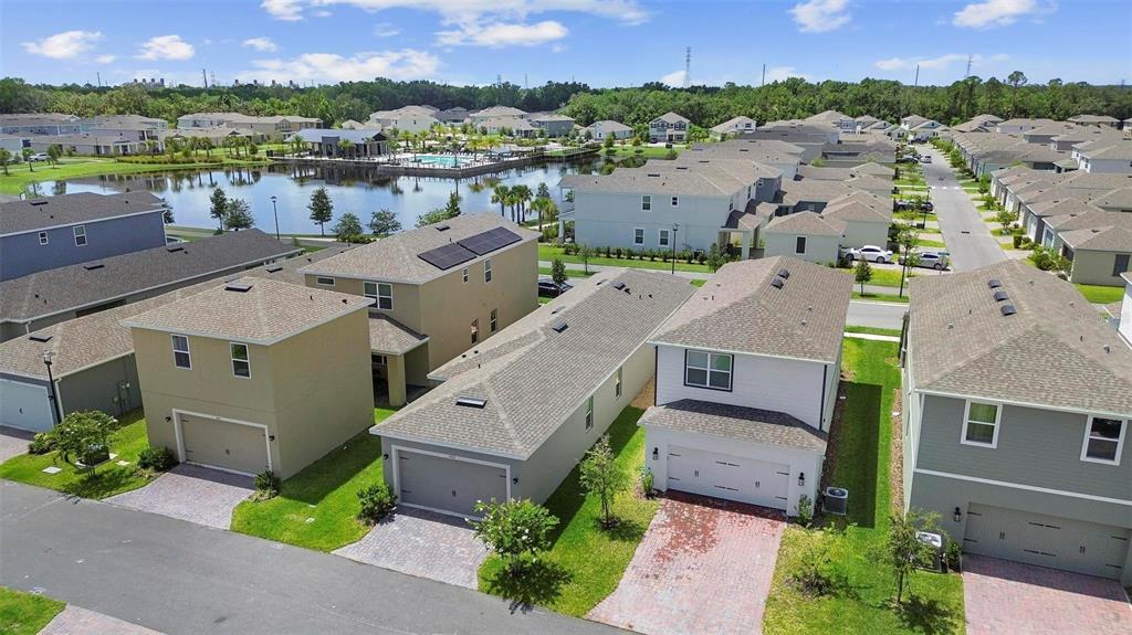 730 Rivington Drive DeBary, FL 32713 - Photo 11 of 47 an aerial view of a house with a garden and lake view