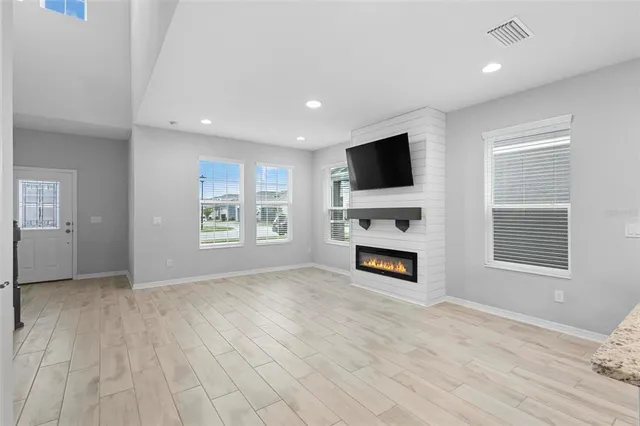 a view of livingroom with furniture flat screen tv and window