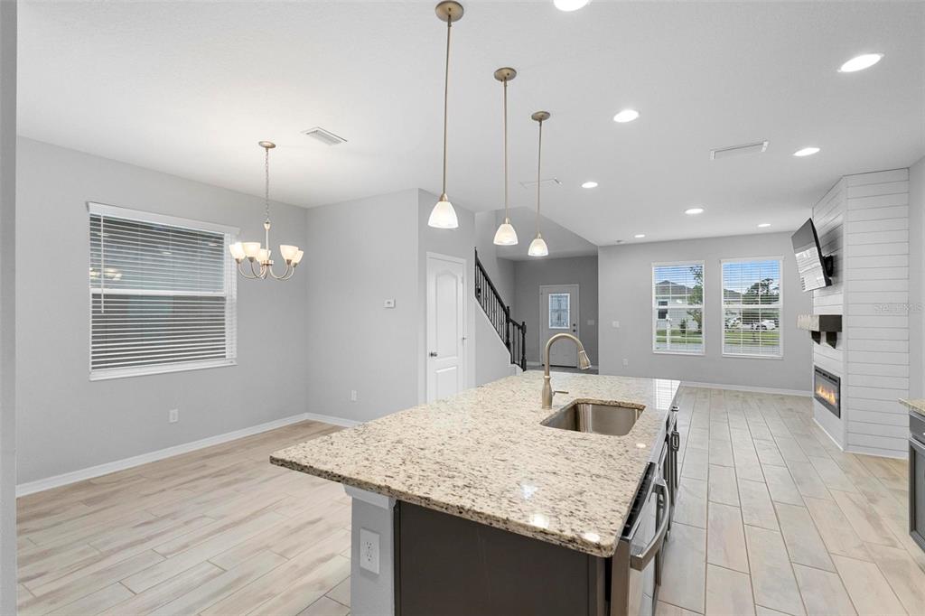 730 Rivington Drive DeBary, FL 32713 - Photo 24 of 47 a kitchen with a table and chairs