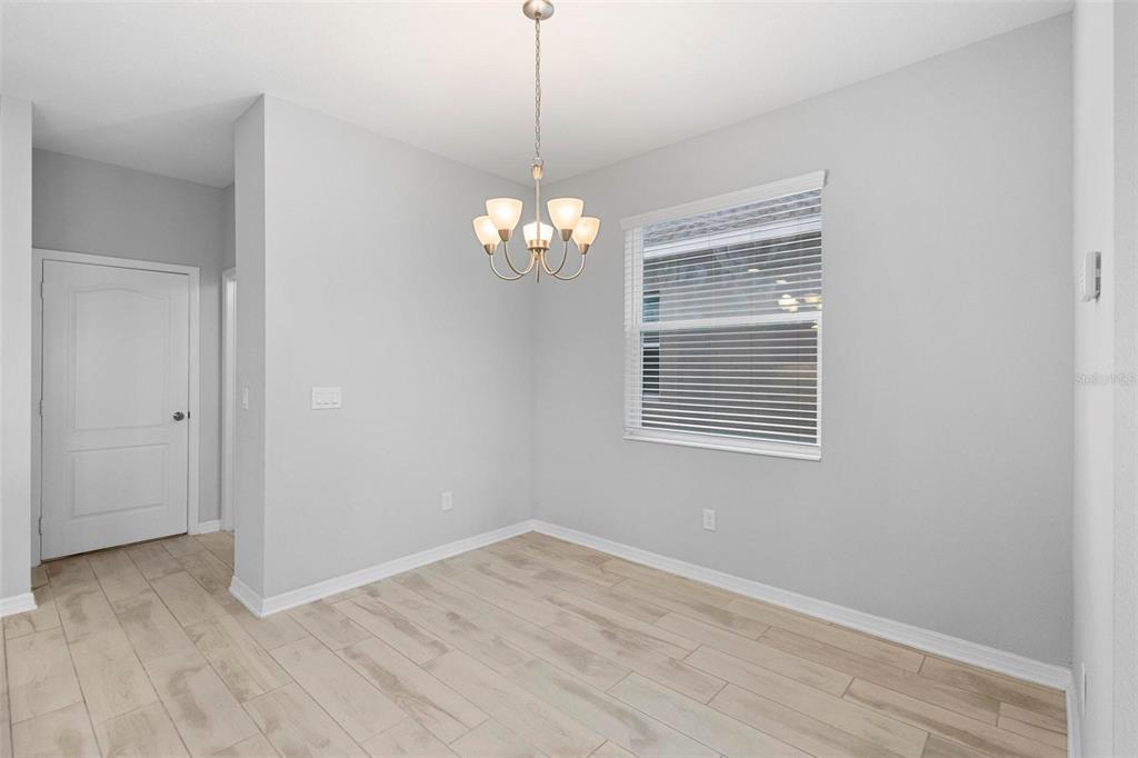 730 Rivington Drive DeBary, FL 32713 - Photo 27 of 47 a view of livingroom with chandelier and wooden floor