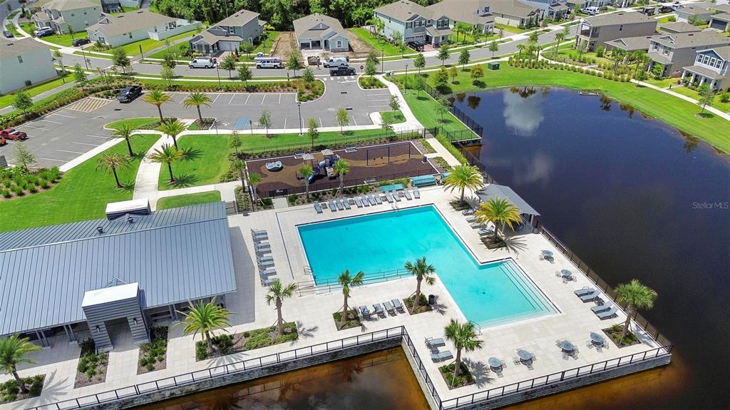 730 Rivington Drive DeBary, FL 32713 - Photo 45 of 47 an aerial view of a house with a garden and lake view