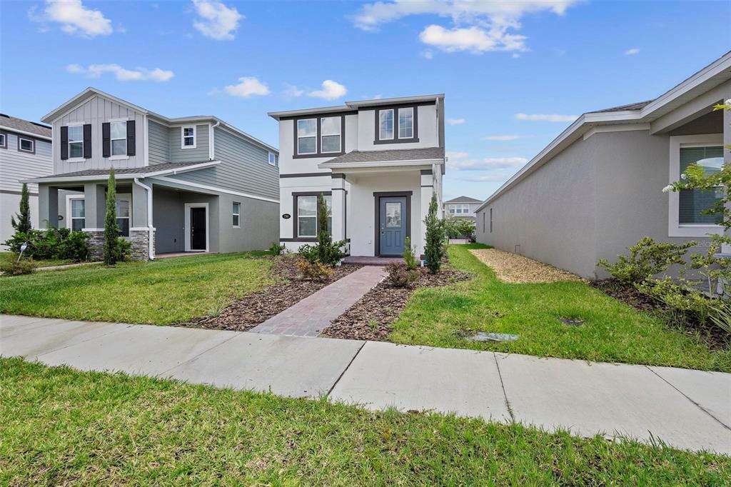 730 Rivington Drive DeBary, FL 32713 - Photo 6 of 47 a front view of a house with garden