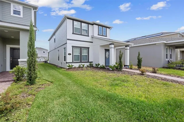 a front view of a house with a yard