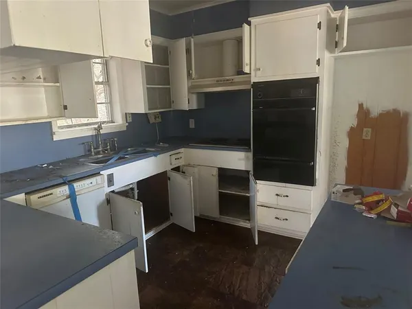a kitchen with a sink and cabinets