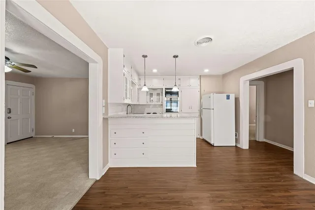 a view of kitchen with wooden floor