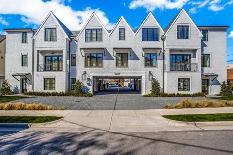 a view of multiple houses with a yard