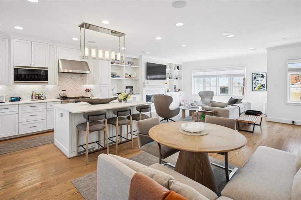 3420 Rosedale Avenue, Unit 2 University Park, TX 75205 - Photo 14 of 28 a living room with furniture a flat screen tv and kitchen view