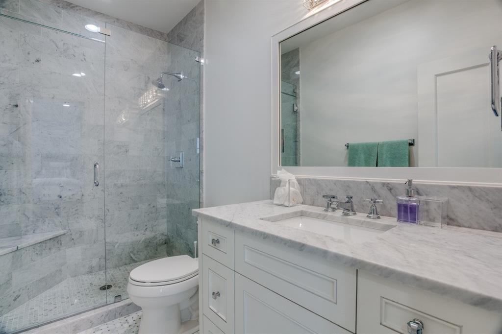 3420 Rosedale Avenue, Unit 2 University Park, TX 75205 - Photo 16 of 28 a bathroom with a sink a toilet and shower