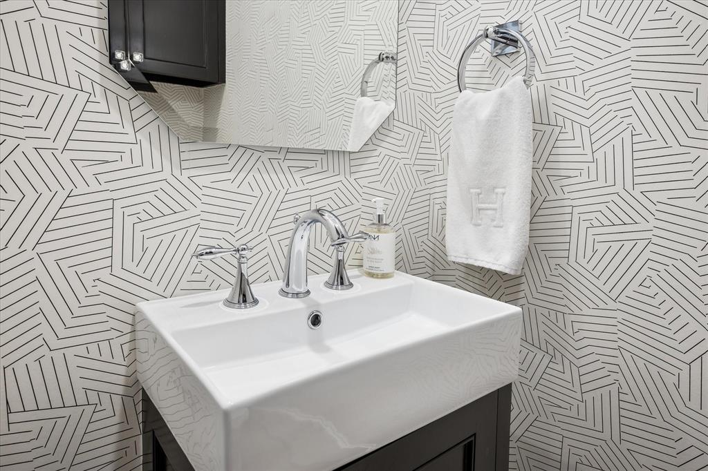 3420 Rosedale Avenue, Unit 2 University Park, TX 75205 - Photo 17 of 28 a bathroom with a sink and a mirror