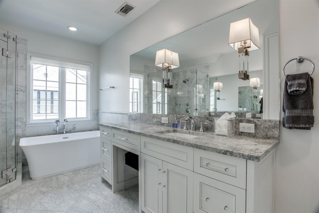 3420 Rosedale Avenue, Unit 2 University Park, TX 75205 - Photo 20 of 28 a bathroom with a granite countertop sink a large mirror and a bathtub