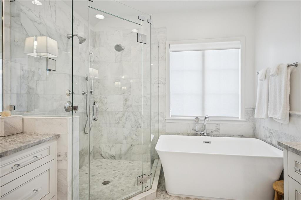 3420 Rosedale Avenue, Unit 2 University Park, TX 75205 - Photo 21 of 28 a bathroom with a bathtub shower sink and mirror