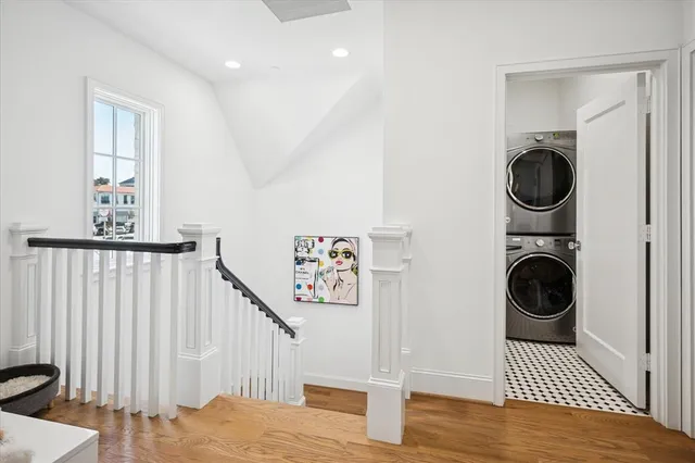 a view of a bedroom with washer and dryer