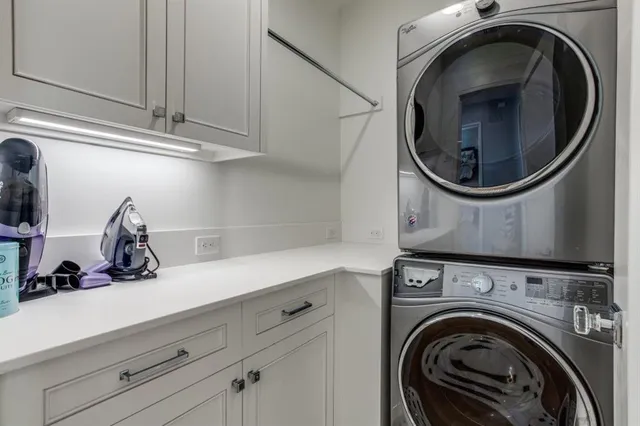 a close view of a utility room with dryer and washer