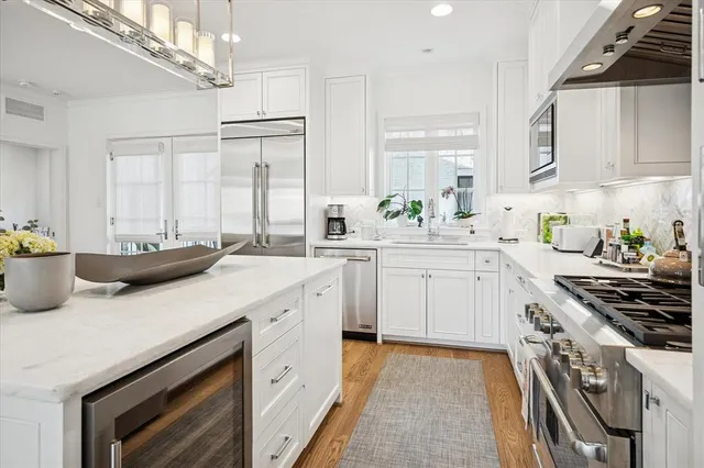 a kitchen with a sink stove and cabinets