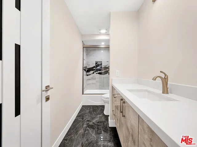 a kitchen with a sink and stove