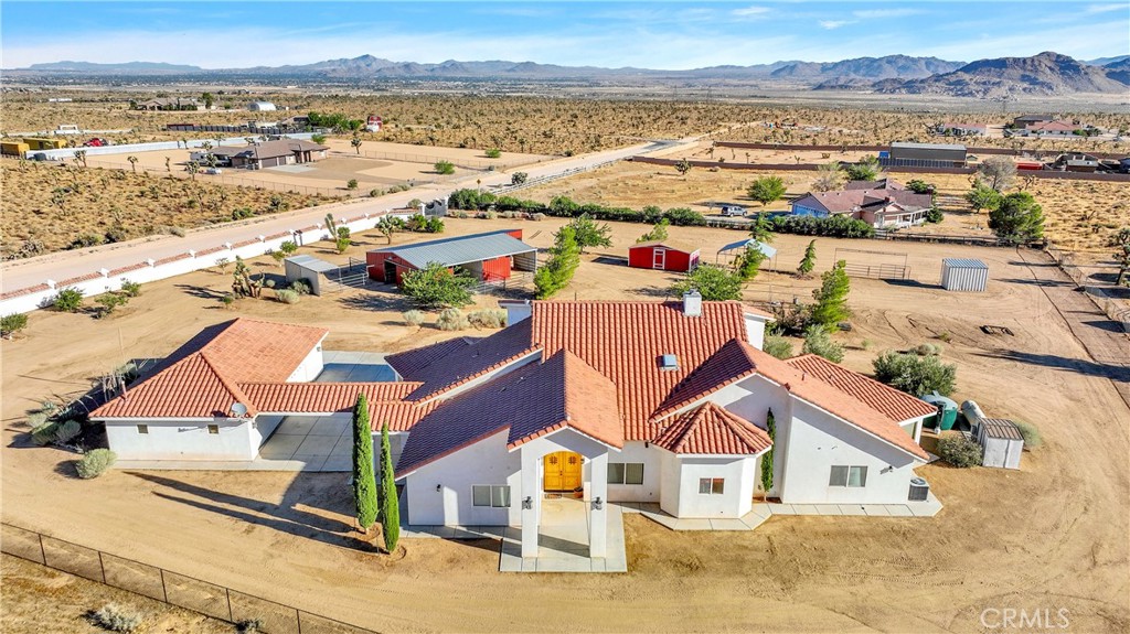 9579 Bowen Ranch Road Apple Valley, CA 92308 - Photo 1 of 1 an aerial view of residential houses with outdoor space