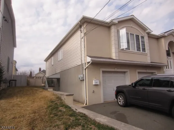 a car parked in front of a house