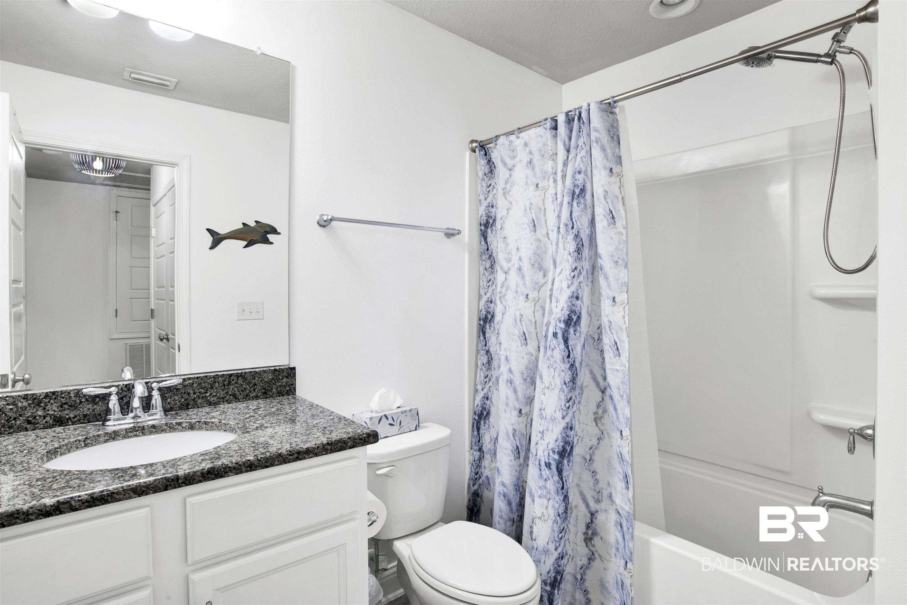25806 Pollard Road, Unit 20 Daphne, AL 36526 - Photo 22 of 29 Full bathroom featuring toilet, shower / bath combination with curtain, and vanity